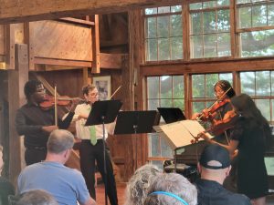 Phillip, William, Aaryn, and Ruby performing in the concert barn