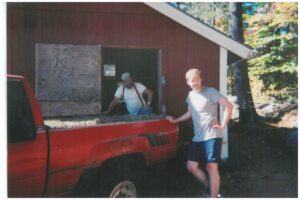 Photo: Mike working on Seward Mountain farm after moving to Sullivan NH, 2001